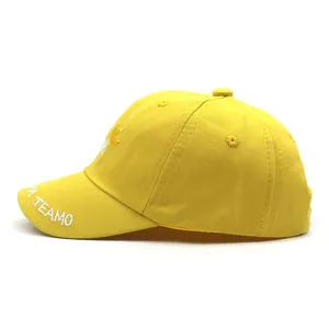 Detail view of yellow baby sun hat with crown embroidery and adjustable strap