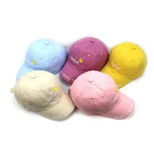 Five assorted colors of embroidered baby baseball caps with crown and bebe lettering