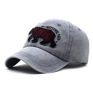 Detail of grey washed cotton baseball cap with Yellowstone bear embroidery