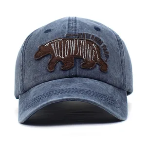 Washed blue baseball cap featuring a brown bear Yellowstone National Park embroidery