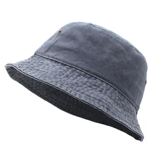 Detailed close-up of cotton bucket hat with reinforced stitching and metal air eyelets