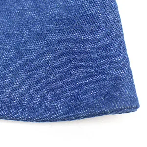 Classic blue denim sun hat with wide brim showing detailed twill texture and stitching