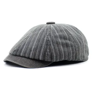 Detail view of a vintage striped dark gray newsboy cap with classic paneled design