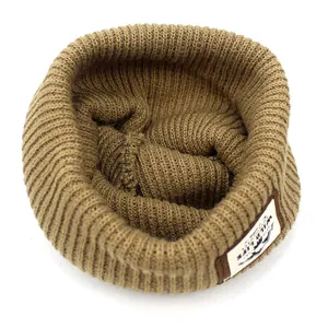 Dark khaki ribbed knit beanie with a wildlife mountain patch for winter warmth