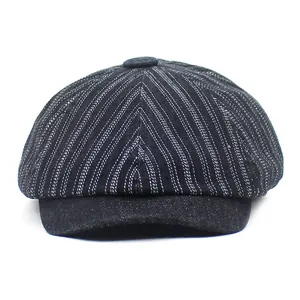 Classic striped newsboy cap in dark denim fabric with retro flat brim design