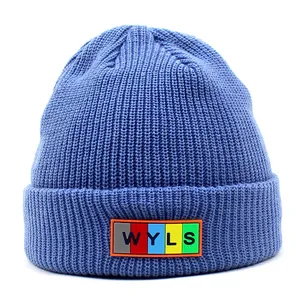 Detailed close-up of blue ribbed knit beanie featuring colorful WYLS letter patch