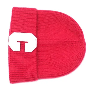 Rose red ribbed knit beanie for women with a white letter G patch for winter warmth