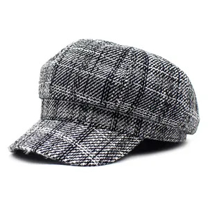 Classic black and white plaid newsboy cap for women made of wool-like tweed fabric