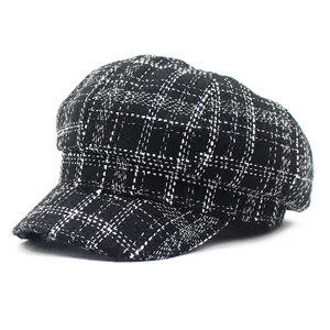 Classic black and white checkered tweed newsboy hat for women featuring a retro design