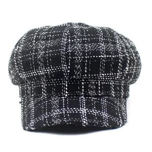 Classic black and white plaid newsboy cap in textured tweed fabric for women