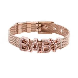 Rose gold mesh bracelet featuring baby letter slider with sparkling rhinestones
