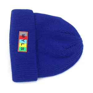 Navy blue ribbed knit beanie with colorful WYLS letter label for winter warmth