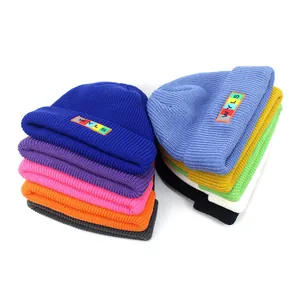 Colorful knitted beanie hats with WYLS letter patch in various vibrant solid candy colors