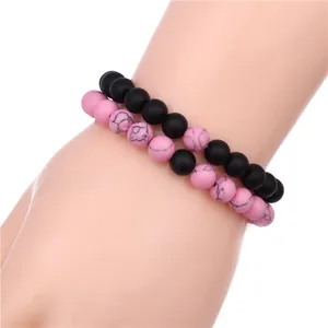 Set of two matte black agate and pink marble stone beaded stretch bracelets for couples