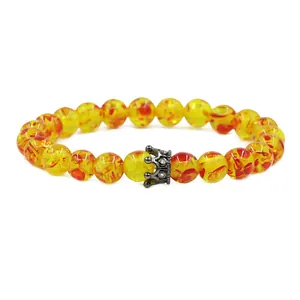 Elastic beaded amber-style bracelet with dark silver CZ crown charm for men and women
