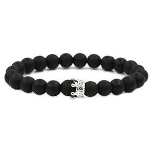 Matte black stone beaded bracelet with a silver zircon crown pendant for men and women