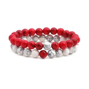 Set of two beaded bracelets with white howlite and red stone beads in 10mm size