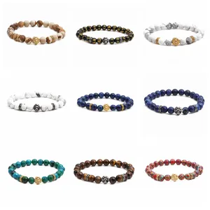 Detailed grid of 8mm beaded bracelets with lion head metal charms in various stones
