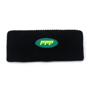Detail of black knitted sports headband with green oval PPP letter logo patch