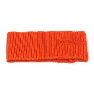 Winter thermal orange ribbed knit headband with elastic texture and warm ear protection
