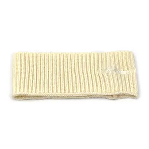 Detailed view of cream rib-knit headband featuring white embroidered letter branding