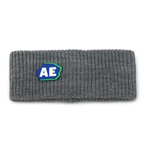 Close-up of grey ribbed knit headband featuring a blue and white AE logo patch detail