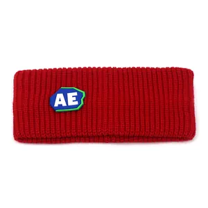 Red knit sports headband with AE letter patch made of thick ribbed wool for winter