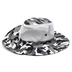 Detailed side view of camo sun hat featuring breathable white mesh fabric and side snap buttons