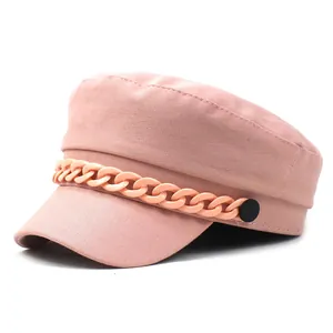 Close-up of pink cotton baker boy hat featuring a stylish decorative plastic chain