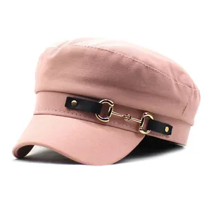 Detailed close-up of pink cotton military cap with golden horsebit metal hardware