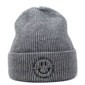 Grey knit beanie featuring a smile logo and rib-knit texture for autumn and winter warmth