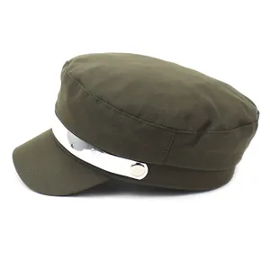 Side view of olive green flat top navy hat with glossy silver metallic band detail