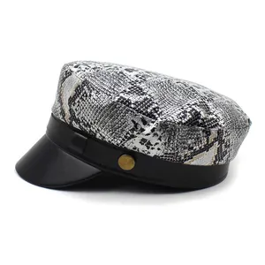 Chic snakeskin texture newsboy cap with black faux leather brim and gold metal button