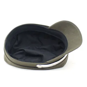 Olive green military flat top cap with silver metal trim and curved brim on white background