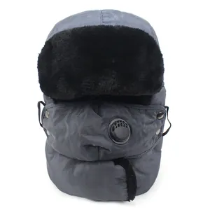 Close-up of winter trapper hat with faux fur trim and integrated breathing valve mask