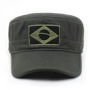 Detail of army green cadet hat featuring geometric embroidery and cotton canvas texture
