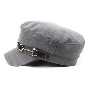 Grey flat top captain hat with black leather strap and golden horsebit buckle hardware