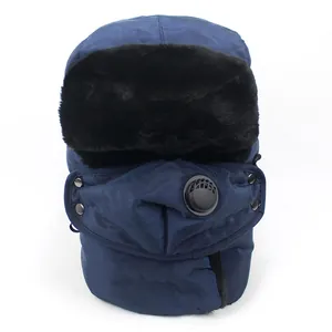 Close-up of a navy winter trapper hat with artificial fleece lining and a breather valve mask