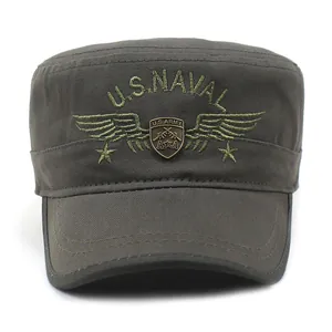Detail of army green flat top hat featuring U.S. NAVAL embroidery and bronze shield badge