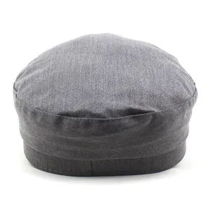 Dark grey cotton fiddler cap with twill texture and flat top in a top-down view