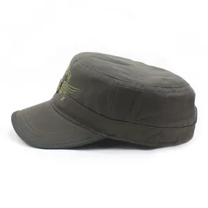 Close-up of military cadet cap side with detailed wing embroidery and metal button decor