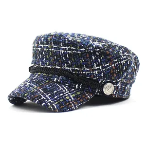 Classic blue and black plaid tweed newsboy hat with braided cord and anchor button detail