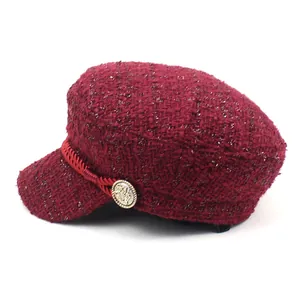 Chic burgundy tweed baker boy hat with braided rope detail and vintage gold button