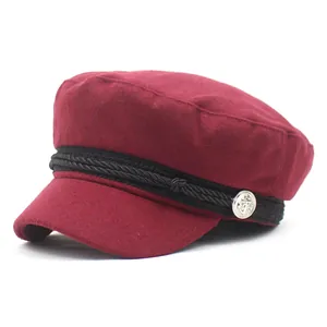 Deep red wool baker boy hat with black braided rope and silver anchor button accents