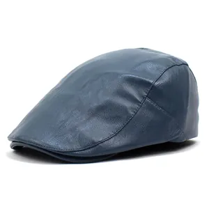 Detailed view of the dark blue PU leather texture and stitching on the flat cap