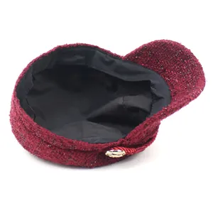 Stylish wine red tweed newsboy cap for women featuring gold button and braided cord detail