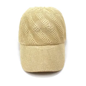 Detail of breathable woven straw texture and curved brim on summer baseball cap