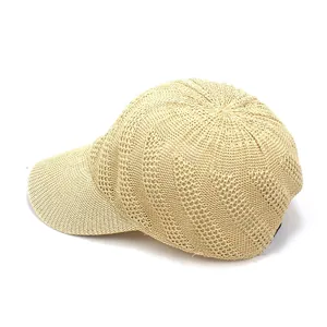Close-up of beige breathable woven mesh texture on a summer baseball sun hat for women