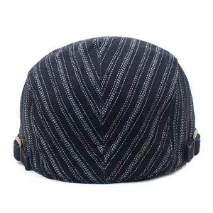Men's retro pinstripe flat cap in dark fabric with bronze adjustable side buckles