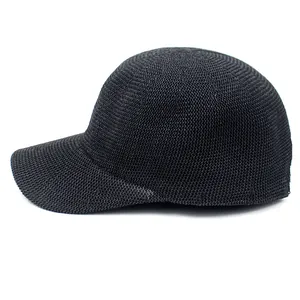Detail of breathable black straw woven texture on a minimalist women baseball cap
